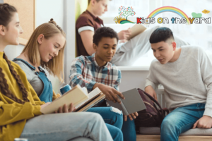Group of multicultural high school teenage high school students doing homework during school break