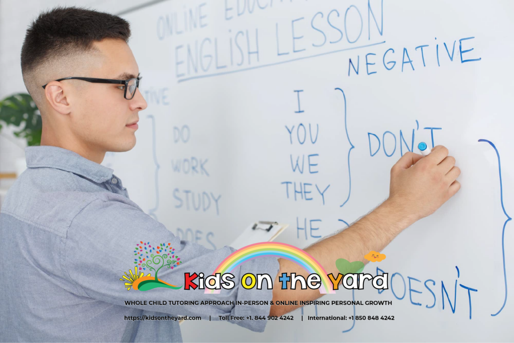 teacher during quarantine. Serious man in glasses writes rules of english on white , online, in-person tutoring,school, homeschooling